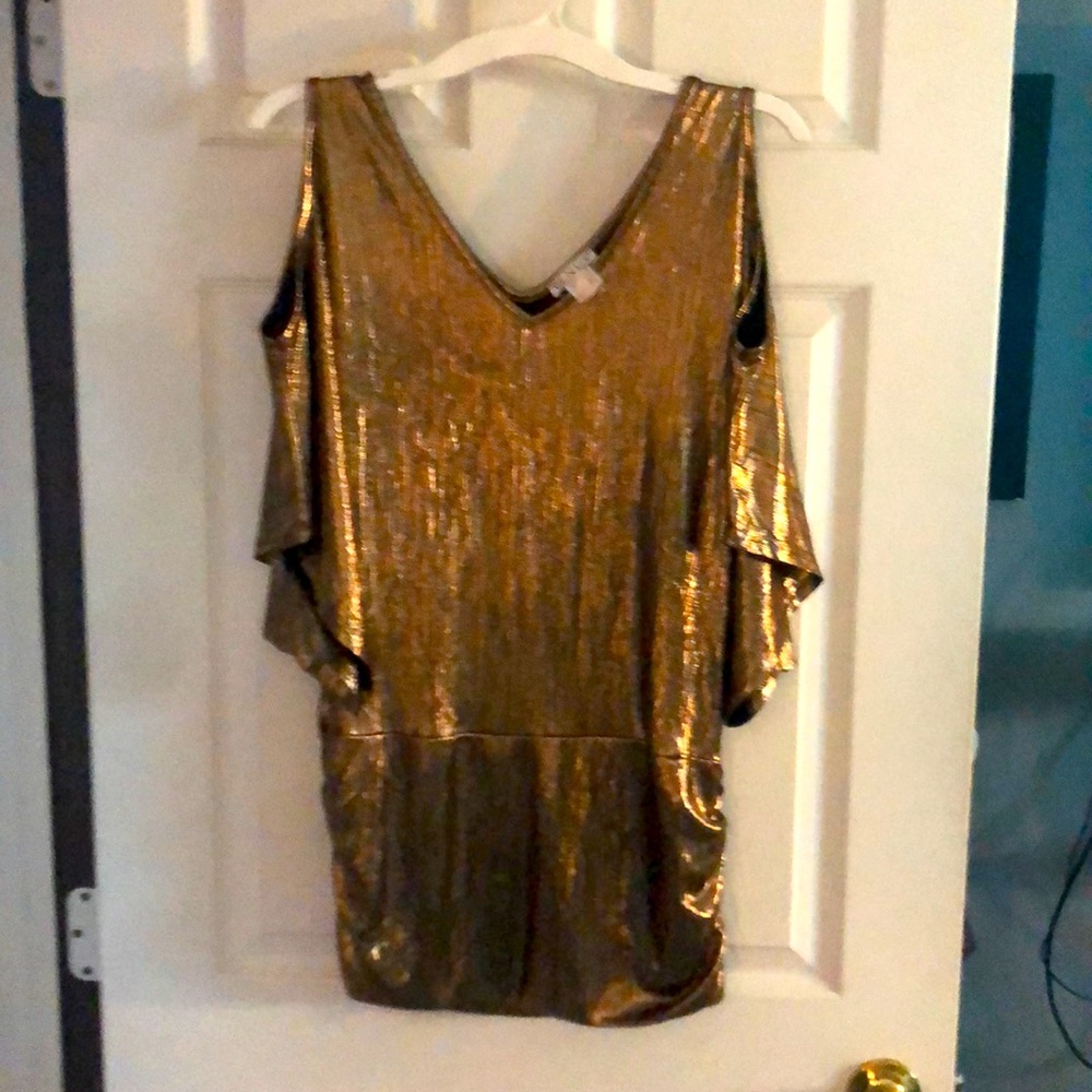 Venus gold top, no flaws. Worn once.